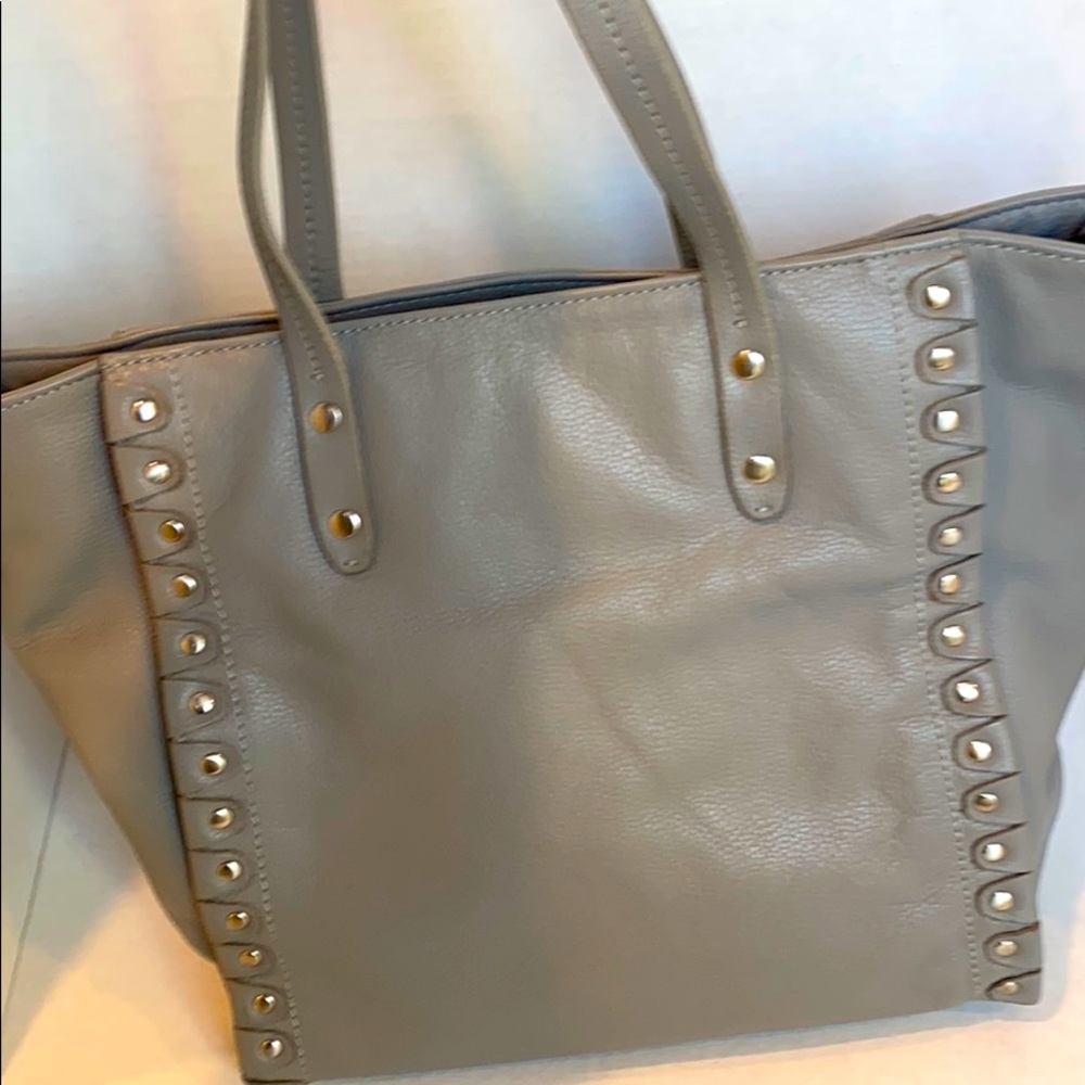 Grey studded leather handbag